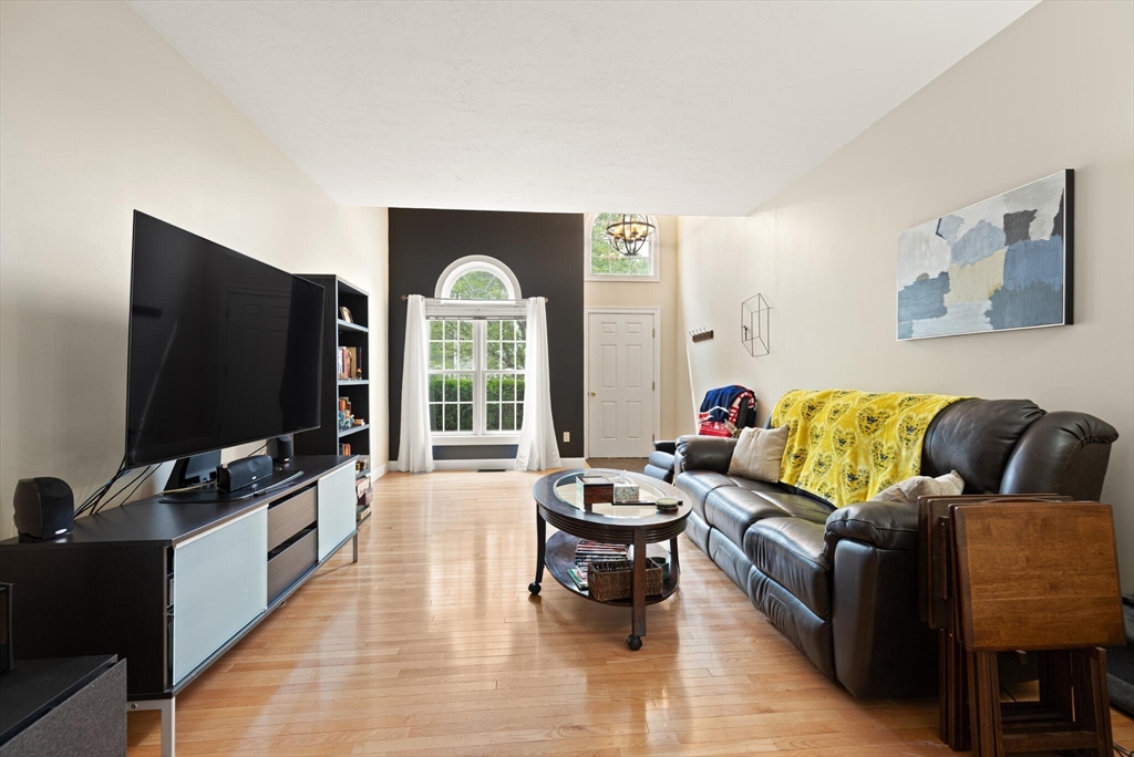 3 Knowlton Circle, Unit 3 Upton, MA 01568 - Photo 10 of 42 a living room with furniture and a flat screen tv