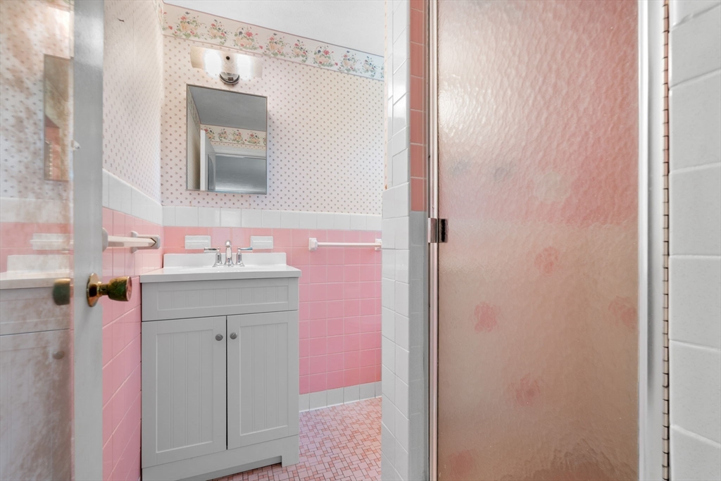 348 Belknap Road Framingham, MA 01701 - Photo 15 of 35 a bathroom with a sink and a mirror