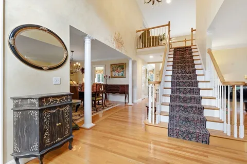 a view of an entryway with wooden floor
