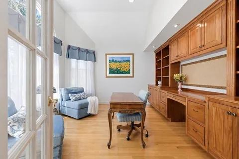 a workspace with furniture and window