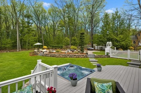 a view of a wooden deck and a garden