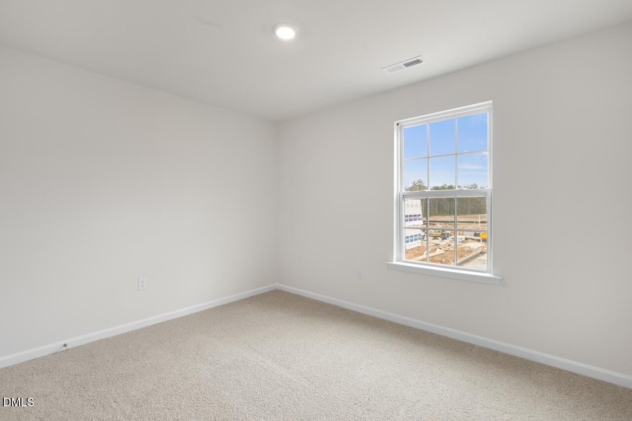 1253 Pavo Path Wendell, NC 27591 - Photo 14 of 41 an empty room with a window