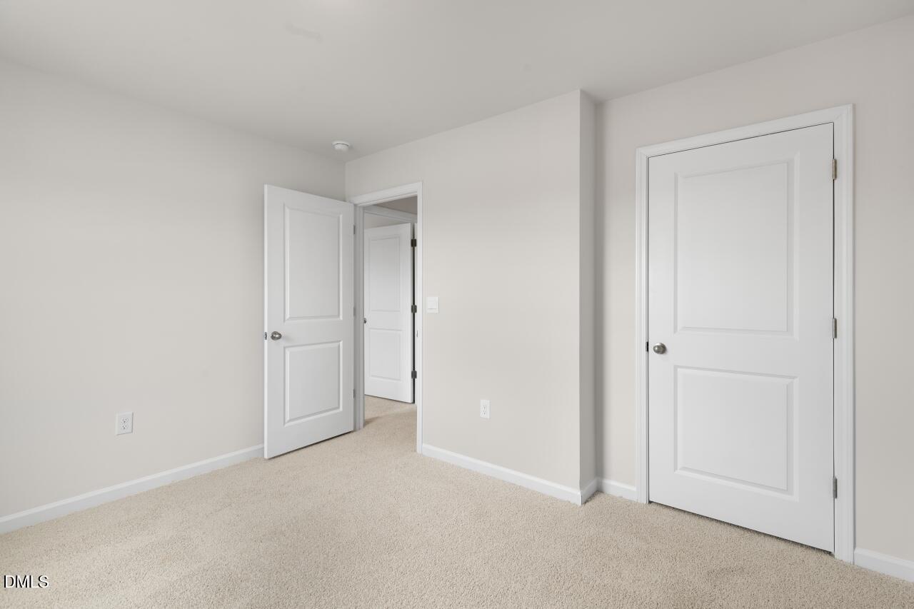 1253 Pavo Path Wendell, NC 27591 - Photo 17 of 41 a view of an empty room and closet area