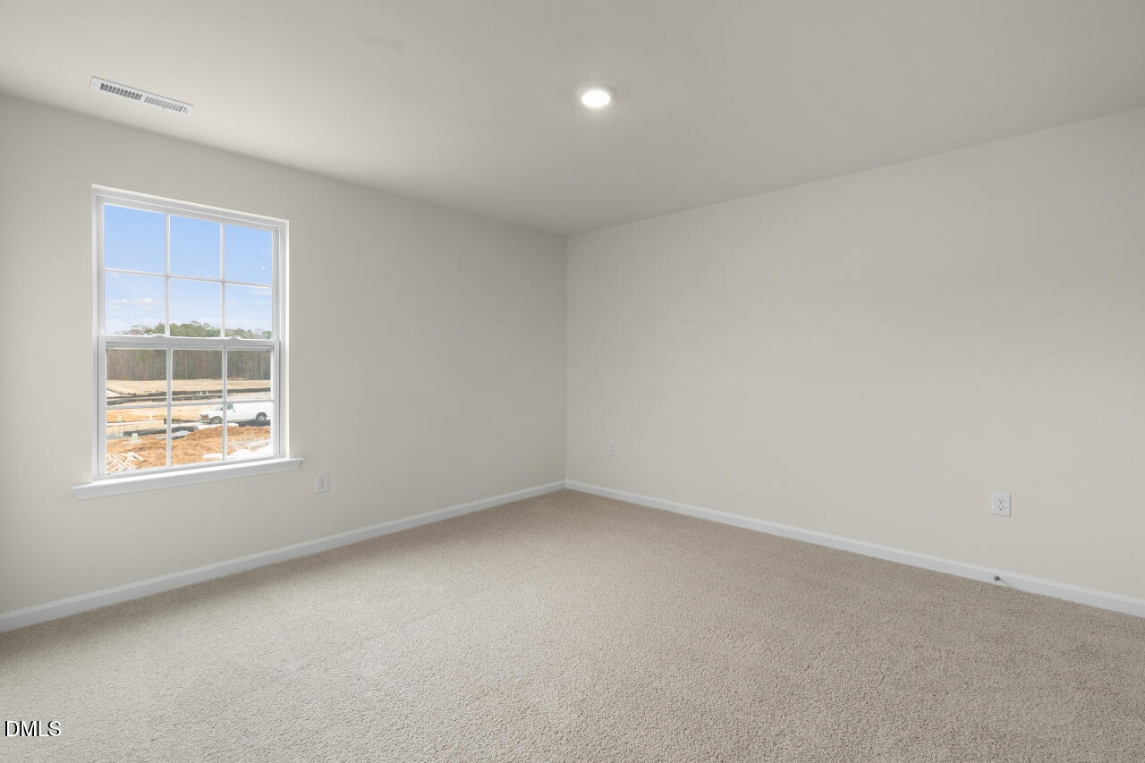 1253 Pavo Path Wendell, NC 27591 - Photo 18 of 41 an empty room with a window