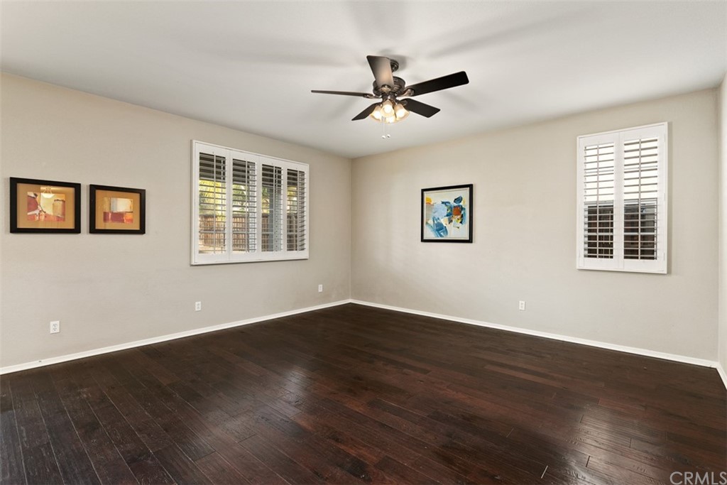46945 Peach Tree Street Temecula, CA 92592 - Photo 12 of 32 a view of a big room with wooden floor and windows