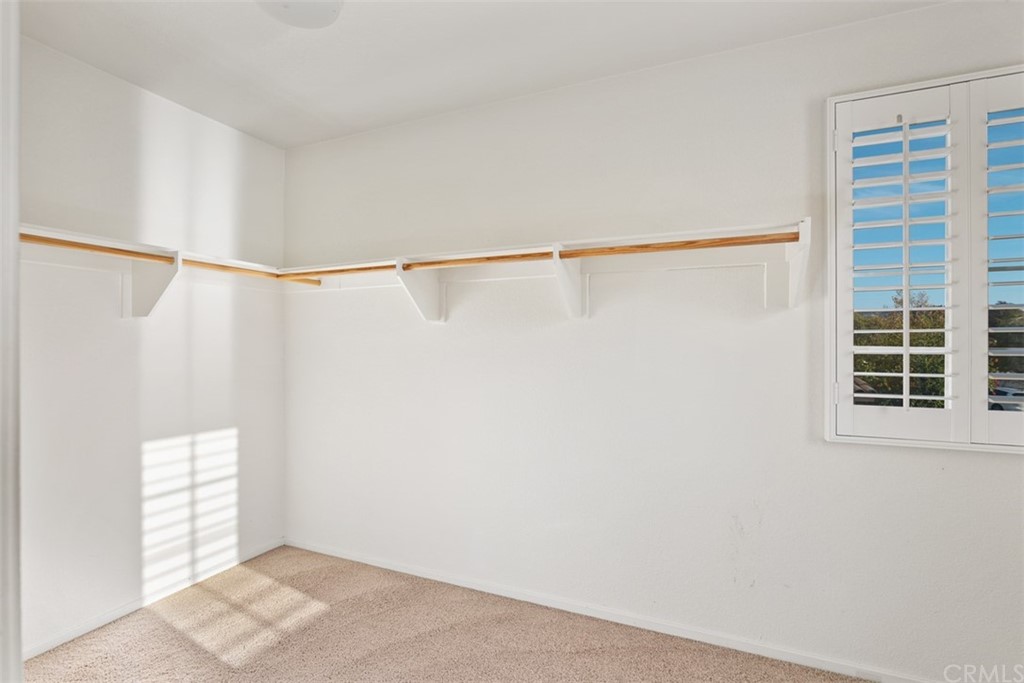 46945 Peach Tree Street Temecula, CA 92592 - Photo 21 of 32 a view of an empty room with a window and closet