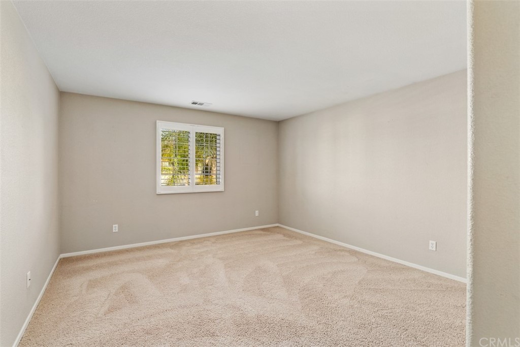 46945 Peach Tree Street Temecula, CA 92592 - Photo 22 of 32 an empty room with windows