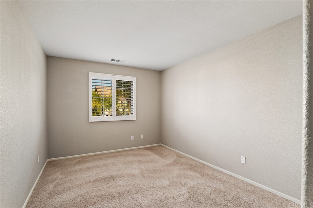 46945 Peach Tree Street Temecula, CA 92592 - Photo 24 of 32 an empty room with a window