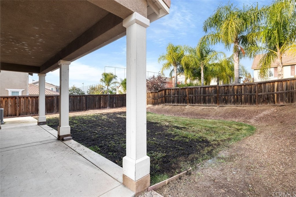 46945 Peach Tree Street Temecula, CA 92592 - Photo 26 of 32 a view of a backyard with wooden fence