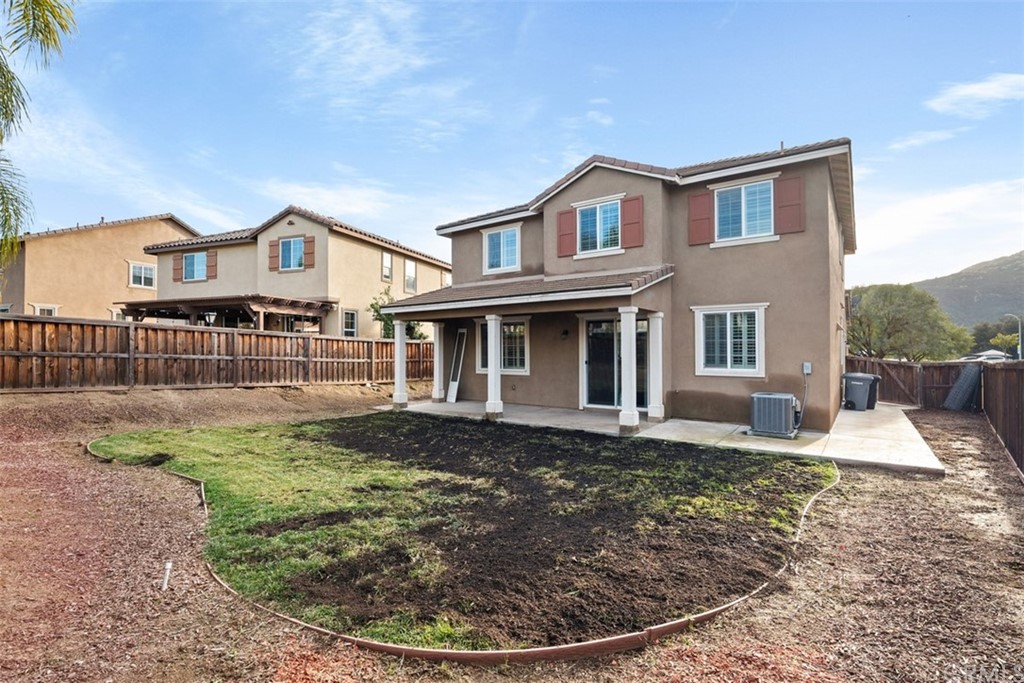 46945 Peach Tree Street Temecula, CA 92592 - Photo 28 of 32 a view of a house with a porch