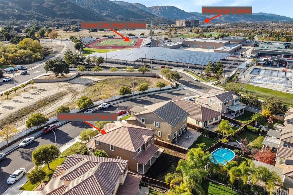 46945 Peach Tree Street Temecula, CA 92592 - Photo 29 of 32 an aerial view of residential houses with outdoor space