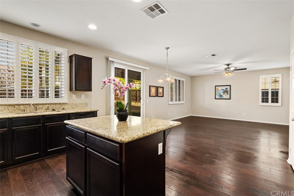 46945 Peach Tree Street Temecula, CA 92592 - Photo 10 of 32 a kitchen with a counter space a sink and appliances