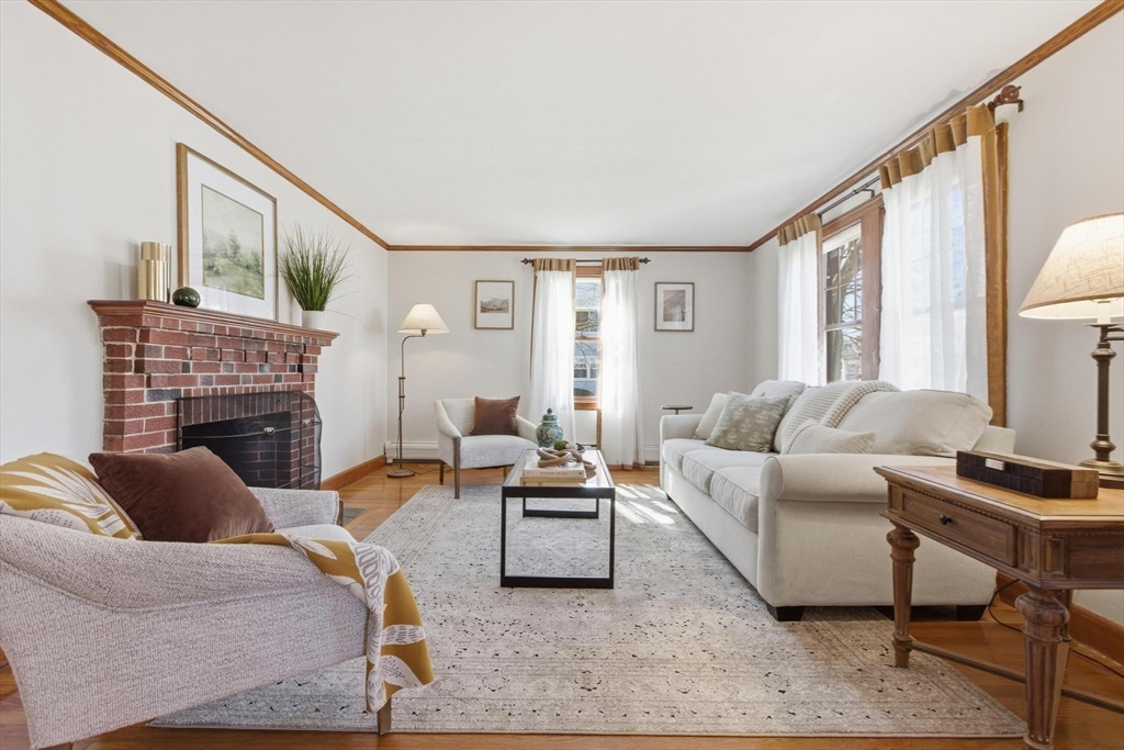 38 Morgan Avenue Wakefield, MA 01880 - Photo 16 of 39 a living room with furniture and a fireplace