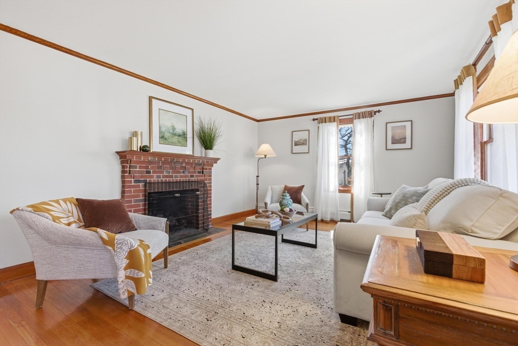 38 Morgan Avenue Wakefield, MA 01880 - Photo 17 of 39 a living room with furniture and a fireplace