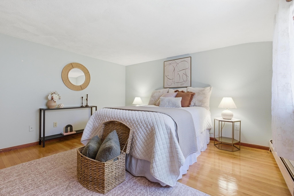 38 Morgan Avenue Wakefield, MA 01880 - Photo 23 of 39 a bedroom with a bed and lamp