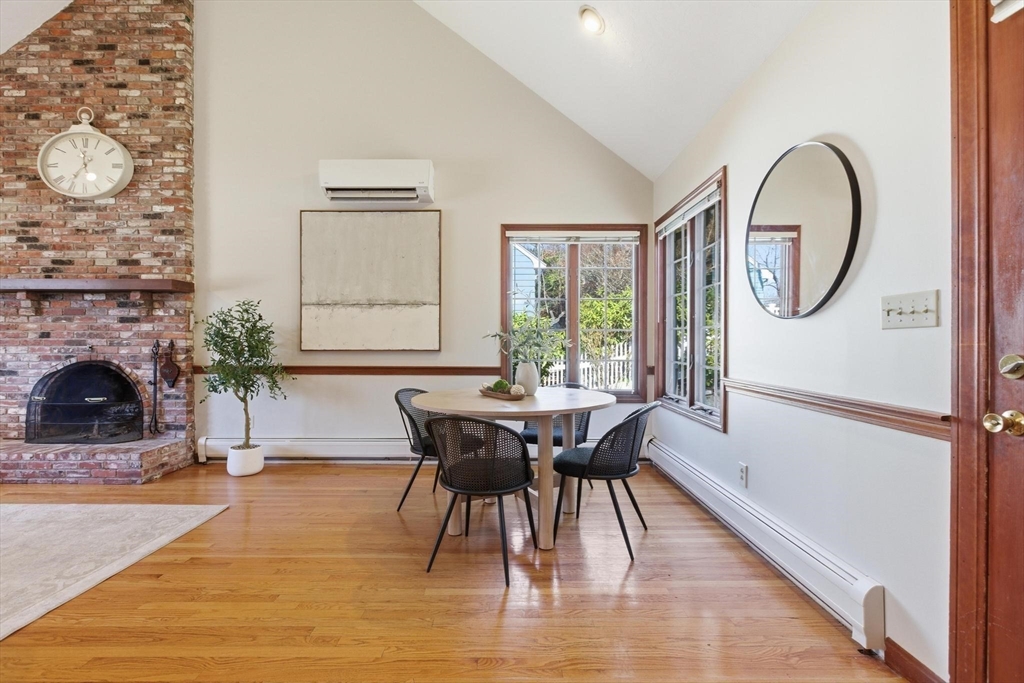 38 Morgan Avenue Wakefield, MA 01880 - Photo 8 of 39 a dining room with furniture a fireplace and wooden floor