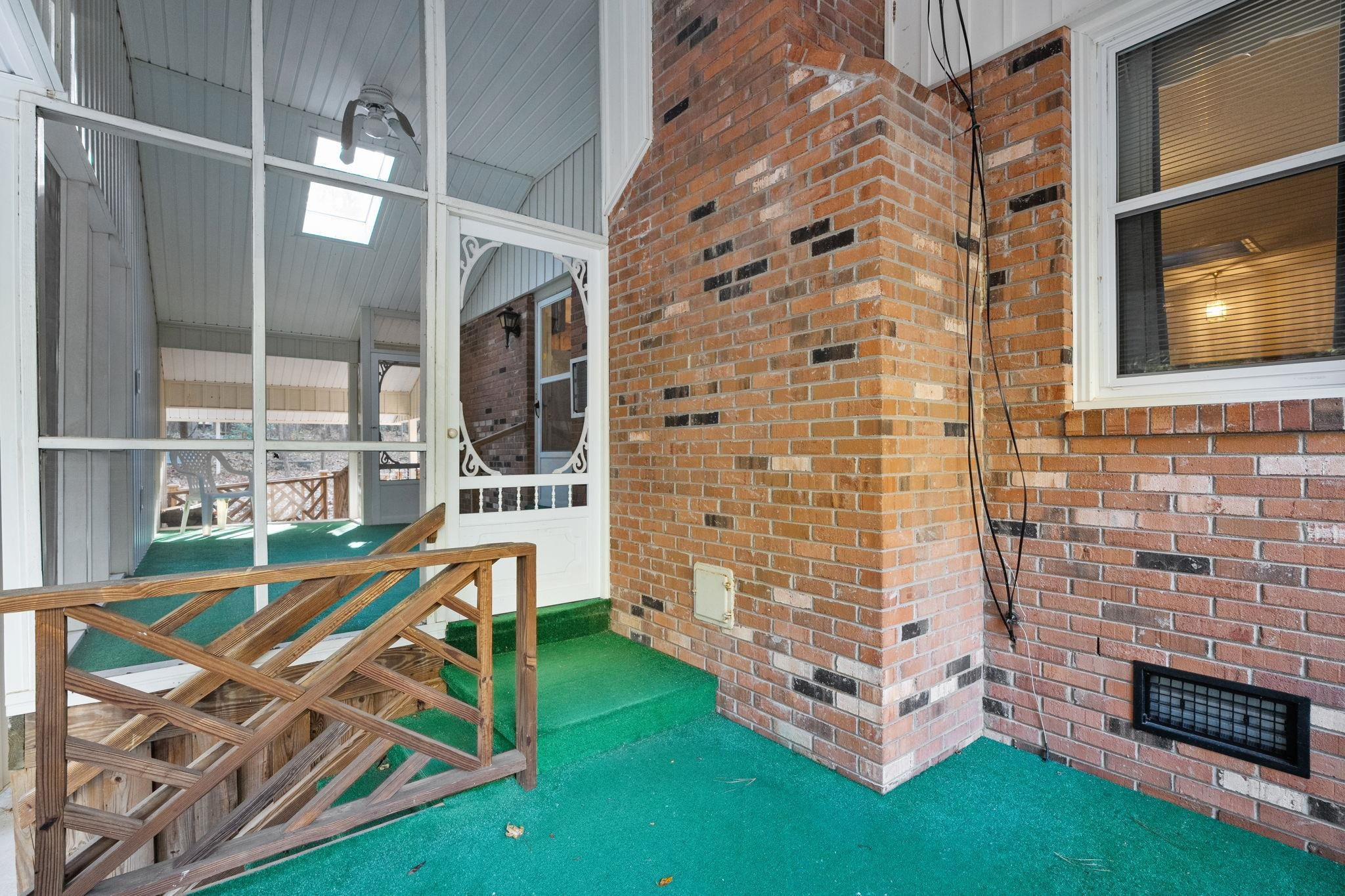 5930 Guess Road Durham, NC 27712 - Photo 30 of 43 a view of roof deck with couches and floor to ceiling window and entryway