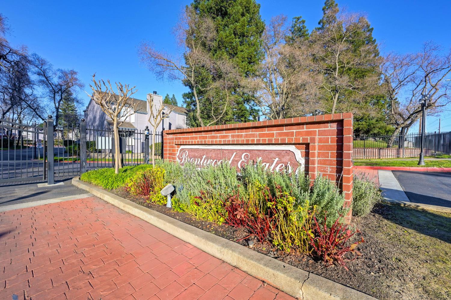 4040 Alex Lane Carmichael, CA 95608 - Photo 1 of 1 a view of a sign on a sidewalk next to a road