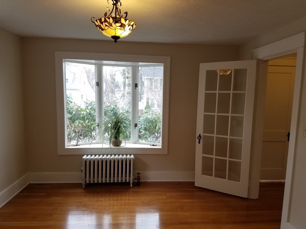 5 Lyndale Road Worcester, MA 01606 - Photo 11 of 22 a view of an empty room with a window and wooden floor