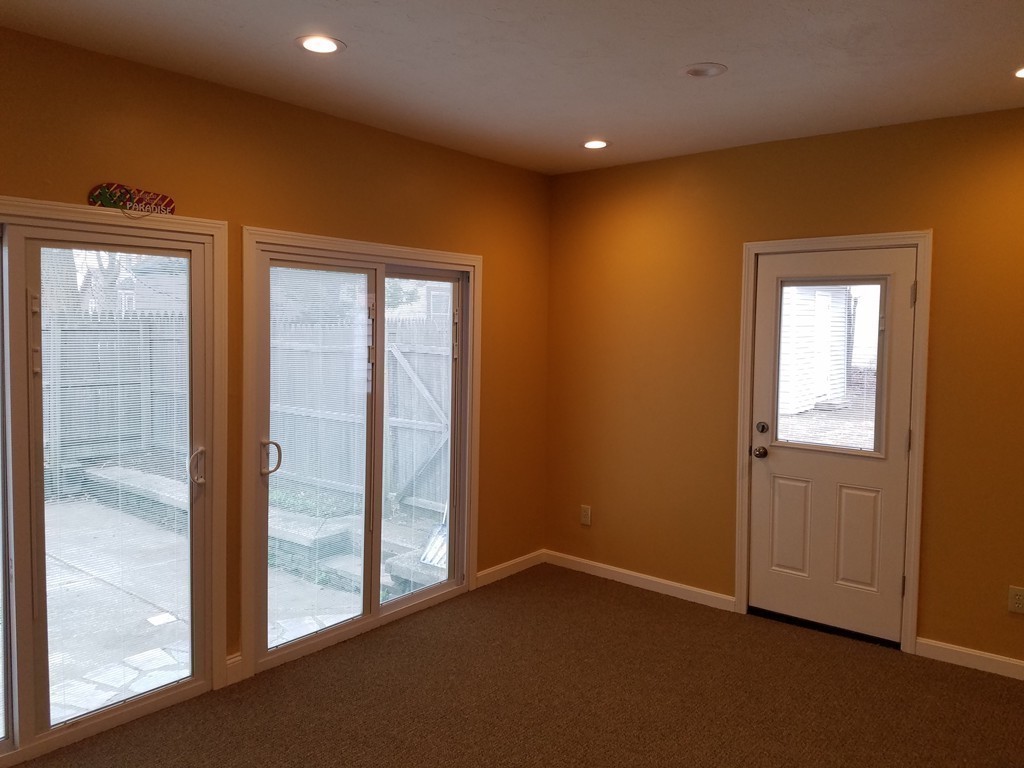 5 Lyndale Road Worcester, MA 01606 - Photo 12 of 22 an empty room with wooden floor and windows