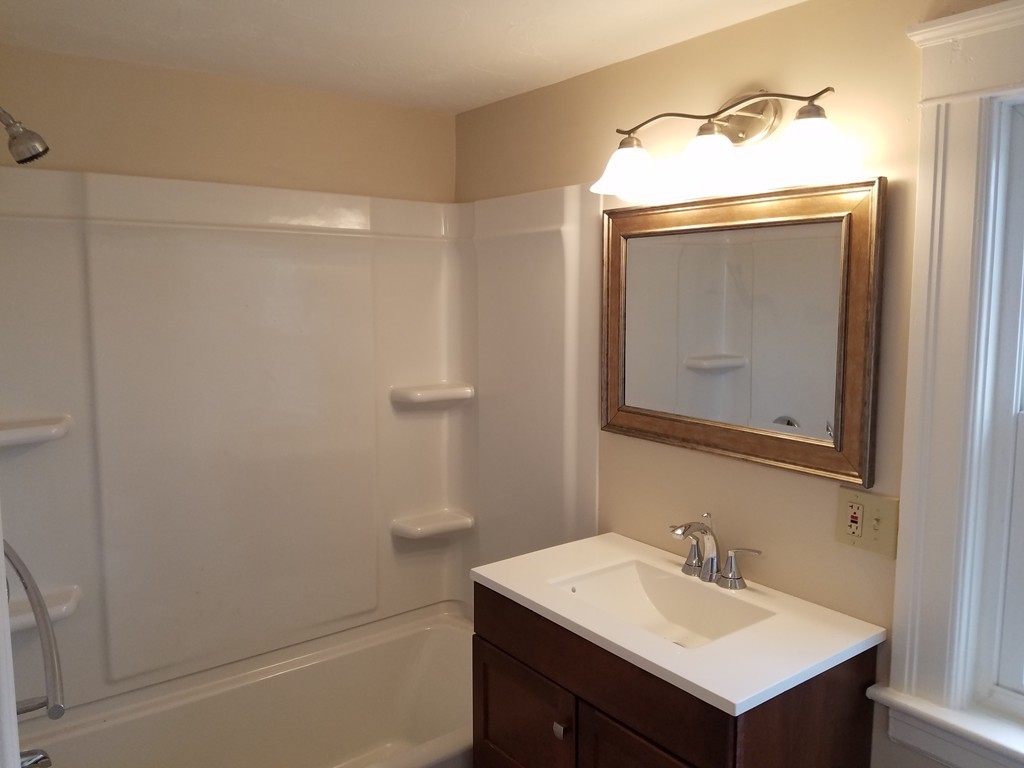 5 Lyndale Road Worcester, MA 01606 - Photo 15 of 22 a bathroom with a sink vanity and mirror