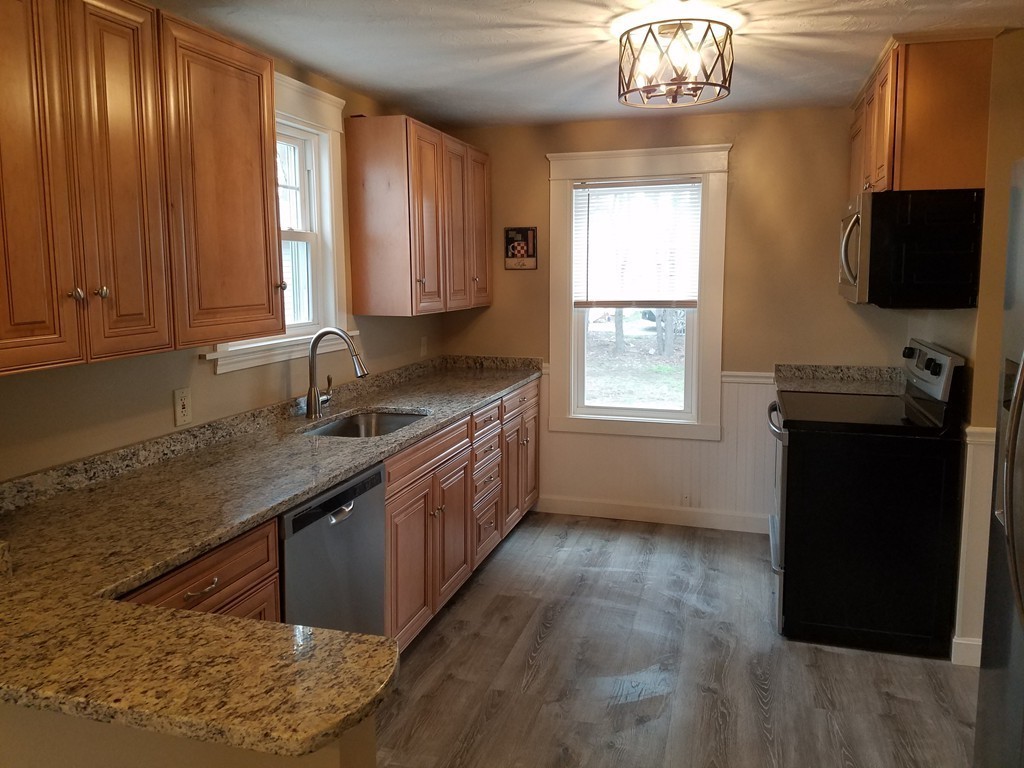 5 Lyndale Road Worcester, MA 01606 - Photo 4 of 22 a kitchen that has a sink window and cabinets