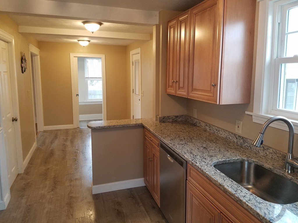 5 Lyndale Road Worcester, MA 01606 - Photo 5 of 22 a kitchen with a sink and cabinets