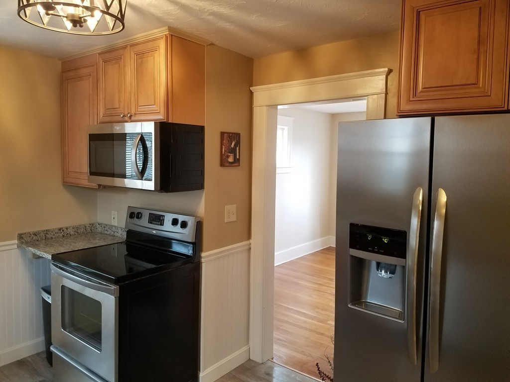 5 Lyndale Road Worcester, MA 01606 - Photo 7 of 22 a kitchen with a refrigerator stove and microwave
