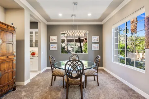 a view of living room filled with furniture and a potted plant
