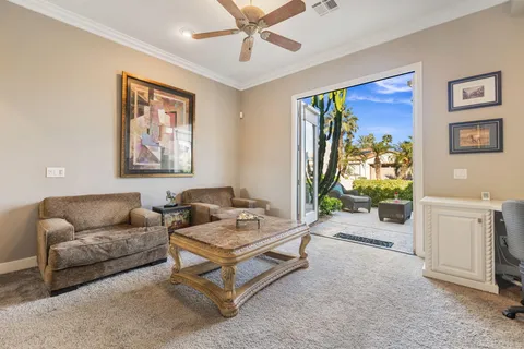 a bathroom with a granite countertop sink mirror vanity and toilet