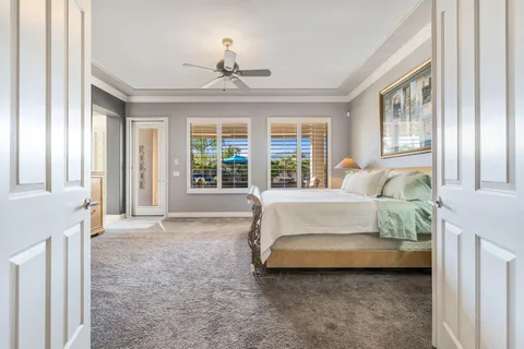 a view of walk in closet with clothes