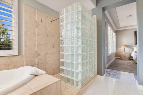 a view of a storage and utility room with washer and dryer