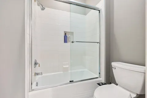 a view of a swimming pool with lounge chairs