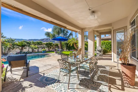a view of a swimming pool with a patio