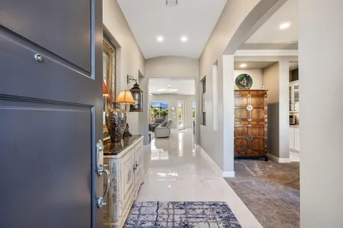 a living room with furniture fireplace and window