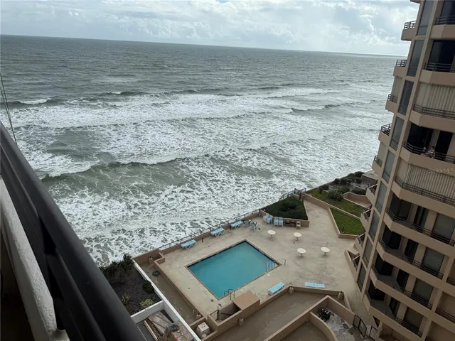 a view of room with window and wooden floor
