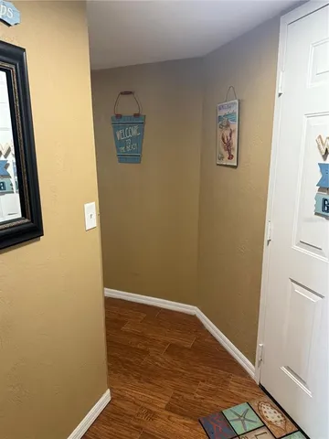 a bedroom with a bed and painting on the wall