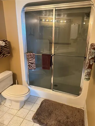 a view of a lake with couches and city view