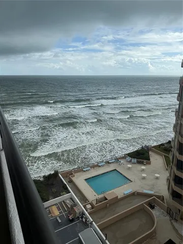 a view of a pool table and chairs