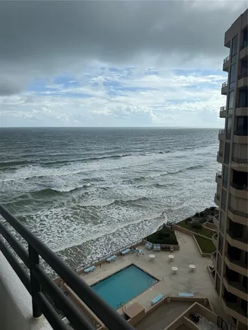 a view of a pool table and chairs in the patio