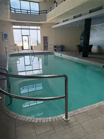 a dining room with furniture and a flat screen tv