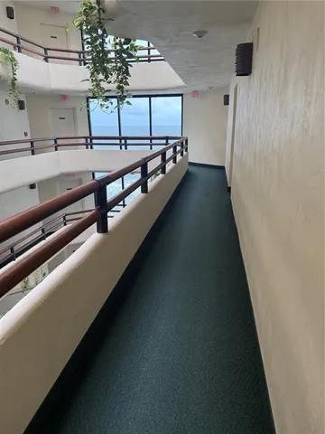 a kitchen with stainless steel appliances granite countertop a refrigerator a stove and a sink