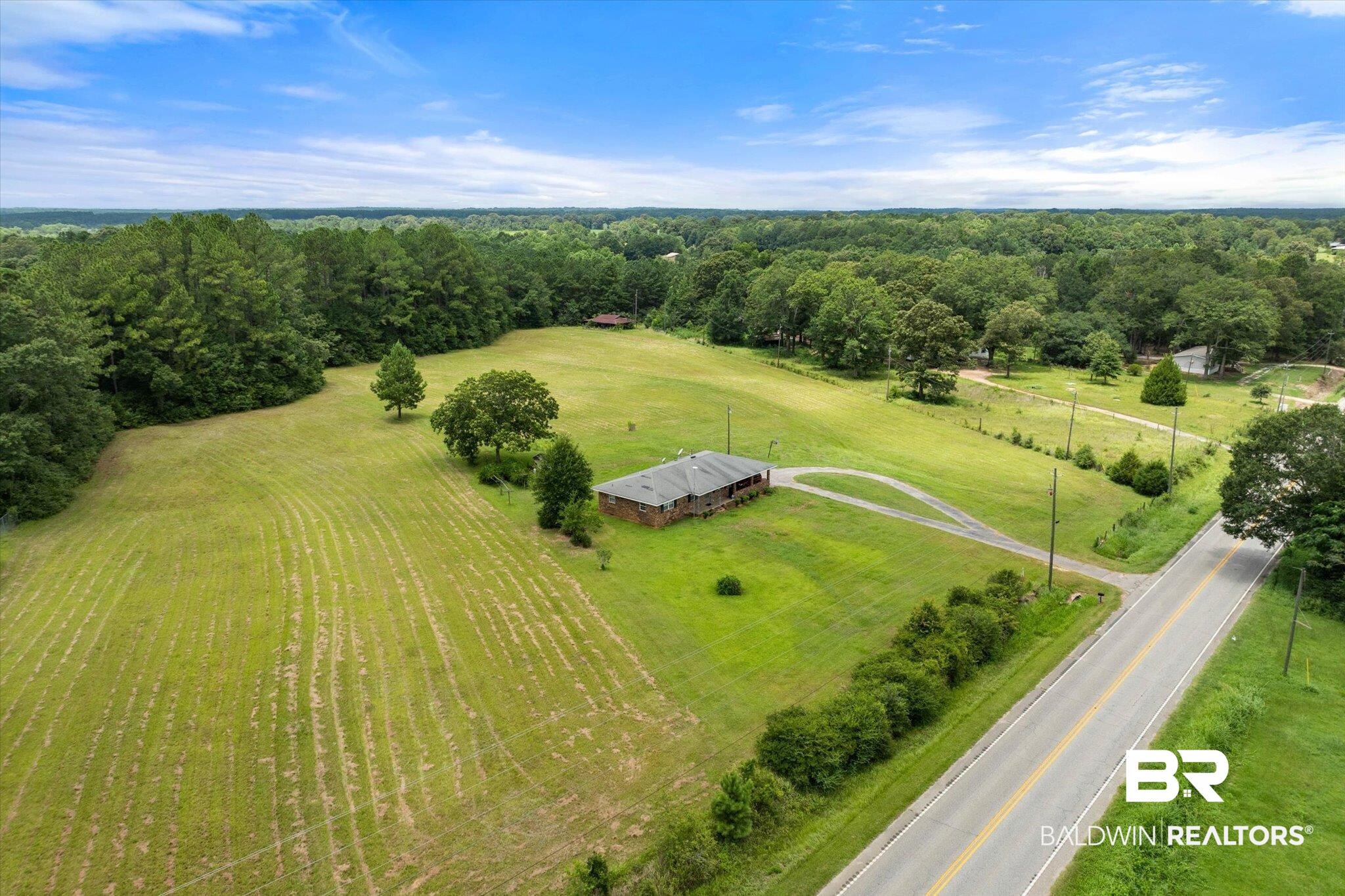 11601 Lott Road Chunchula, AL 36521 - Photo 33 of 34 Aerial view of sparsely populated area with a forest