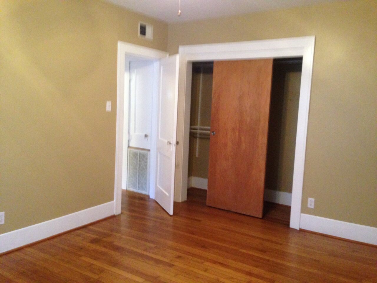 1719 Dunlavy Street Houston, TX 77006 - Photo 13 of 16 an empty room with wooden floor and closet
