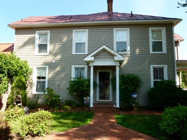 1254 Ladd Road Waynesboro, VA 22980 - Photo 3 of 37 a front view of a house with garden