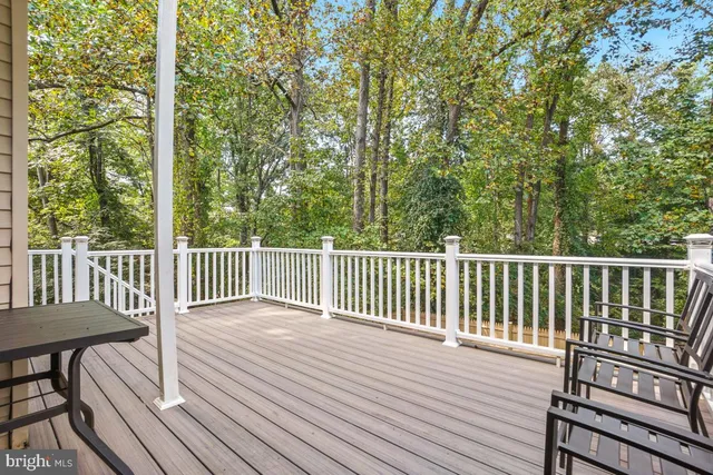 a view of a wooden chairs on deck