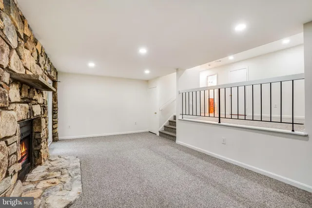 a view of an empty room with stairs