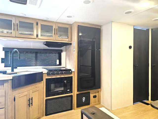 a kitchen with a stove and a refrigerator