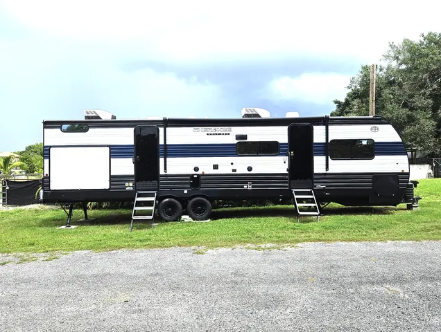 a view of a park with large trees