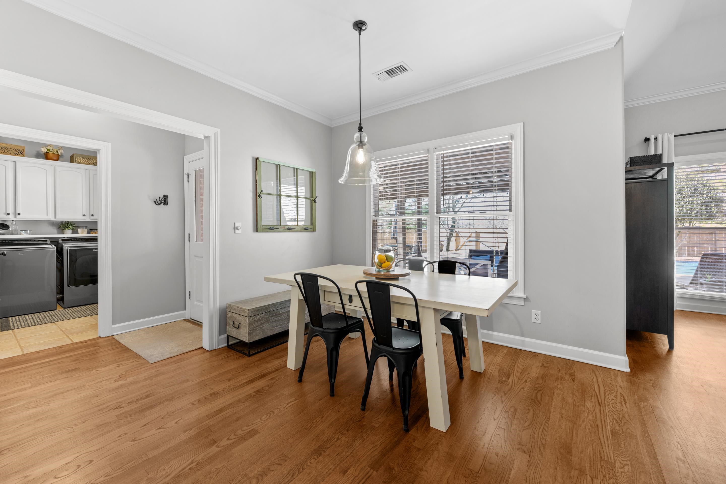 1339 Winoka Road Collierville, TN 38017 - Photo 16 of 40 a view of a dining room with furniture window and wooden floor